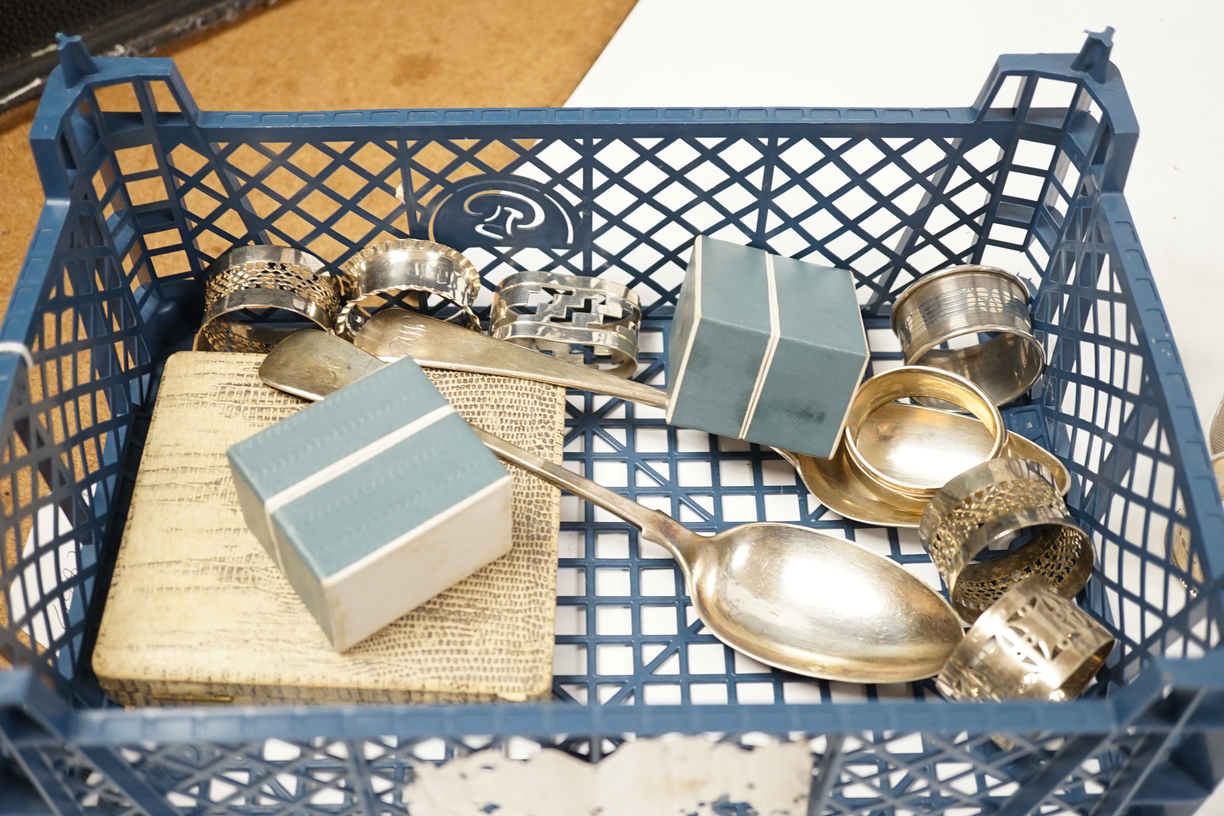 Sundry small silver including a cigarette case, cased set of six sterling and enamel cocktail sticks, two silver toast racks, a silver table spoon and eight silver napkin rings, together with six silver plated napkin rin